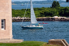 Boating in Front of Brick tower of Avery Point Light